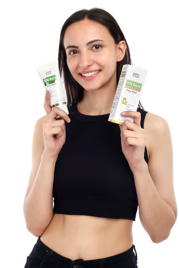 a woman hold both face wash and shampoo a woman hold both face wash and shampoo