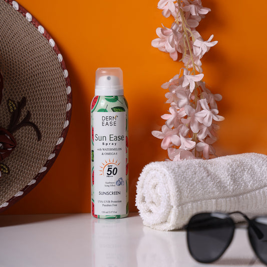 Sun Ease spray bottle with a towel and sunglasses on an orange background