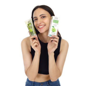 An woman holding green apple scrub An woman holding green apple scrub