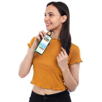 tea ease shampoo hold by a woman with white background tea ease shampoo hold by a woman with white background