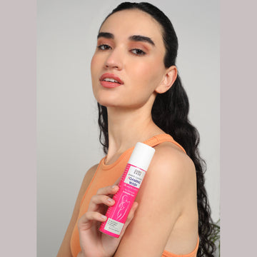 A woman holding intimate cleansing foaming wash A woman holding intimate cleansing foaming wash