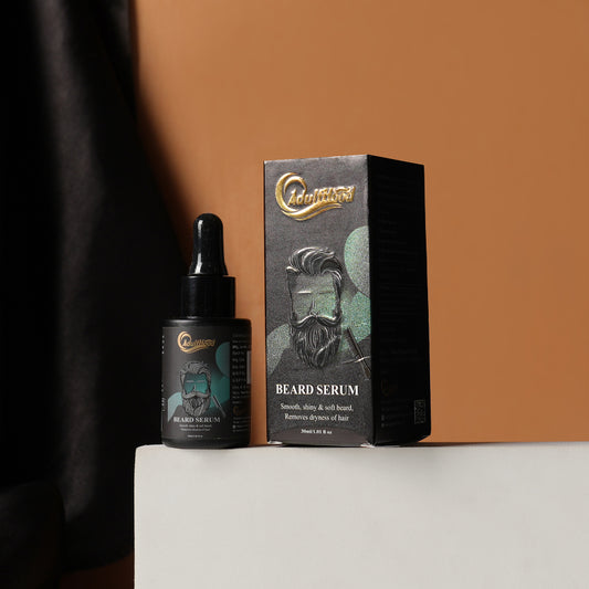 Beard serum bottle and packaging on a white surface with a brown background