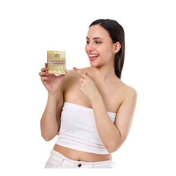 Woman holding a skincare product against a white background Woman holding a skincare product against a white background